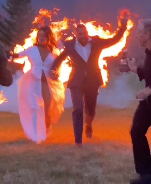 Bride and groom set ON FIRE in bizarre stunt