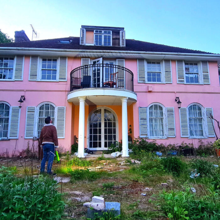 Explorer visits eerie ‘pink palace’ left abandoned with rooms still packed with children’s toys