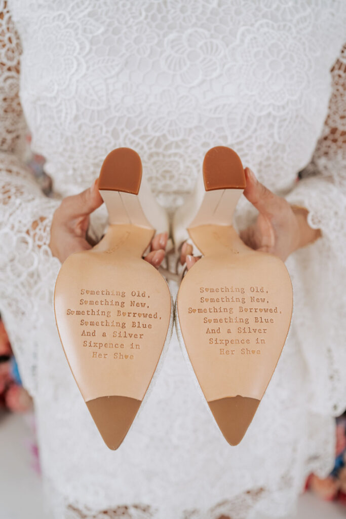 A pair of shoes bearing the classic something borrowed something blue rhyme. 