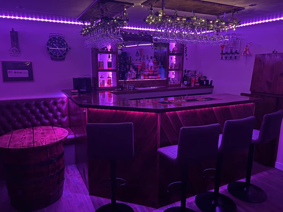Paul has an ultraviolet lit bar in his games room. 