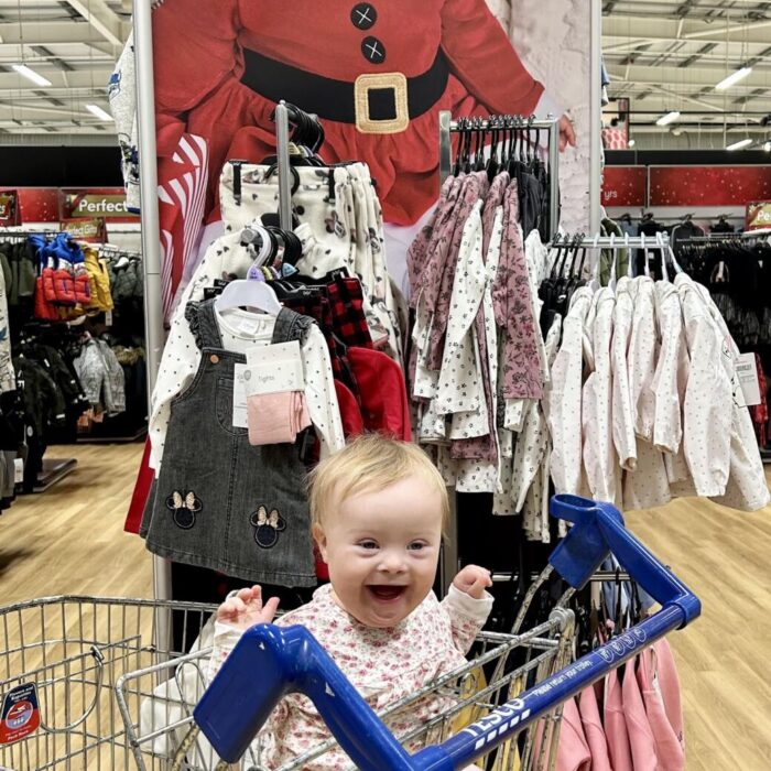 Adorable moment toddler model with Down Syndrome spots own face on Tesco Christmas campaign