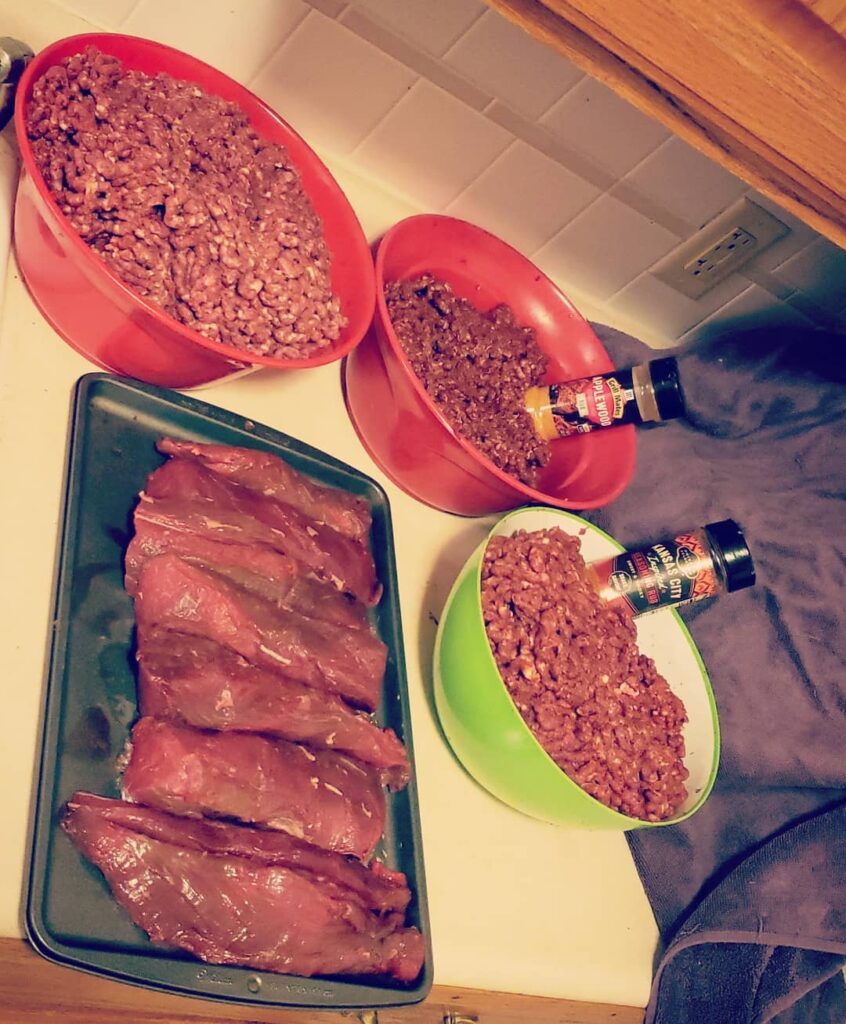 Three bowls show various types of meat mince, with another tray of steaks. 
